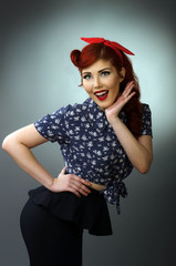 Happy young woman posing in retro outfit