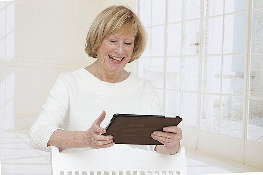 Closeup Of Senior Woman  With Electronic Ipad