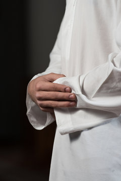 Close-Up Of Male Hands Praying In Mosque