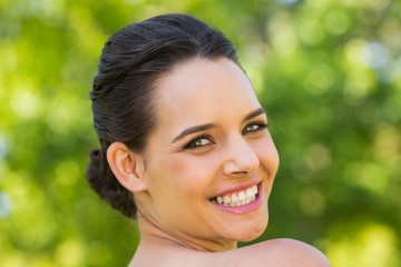 Close-up portrait of beautiful woman in park