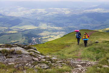 tourists walking in mountains
