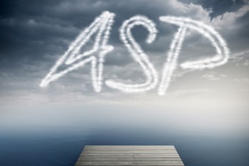 Asp against cloudy sky over ocean