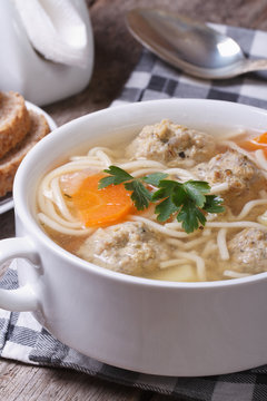 Meatball soup, noodles with vegetables vertical