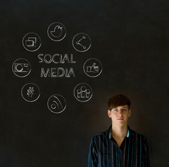Business man or teacher with chalk social media icons