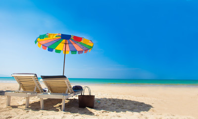 Chairs and umbrella on white sand beach in Thailand Khaolak