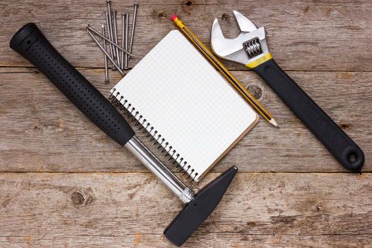 Construction tools and blank notebook