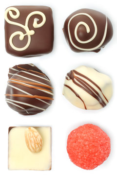 Assorted chocolate candies set on white background