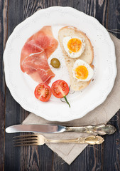 Breakfast prosciutto ham and boiled egg