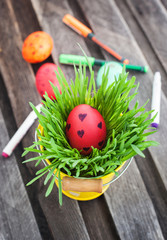 Colorful painted Easter egg on a fresh green grass
