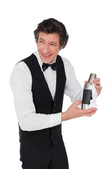 Naklejka premium Bartender using cocktail shaker over white background