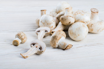 Fresh champignons on a wooden board
