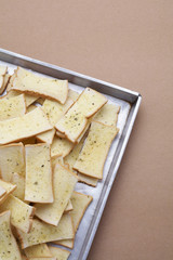 butter and herb bread on brown background