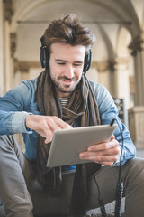 young handsome fashion model using tablet man