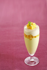 mango pudding in glass on fabric