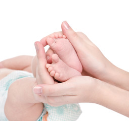 Fototapeta na wymiar Newborn baby feet cupped into mothers hands. isolated on white 