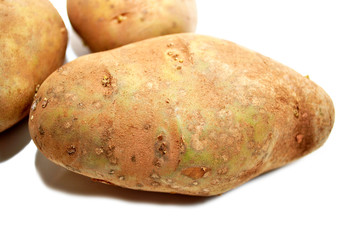Close-Up of a Raw Potato Over White