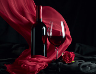 bottle and glass with red