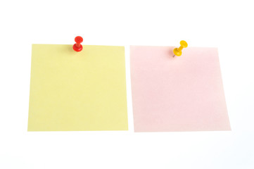 Two paper sheets attached with office buttons isolated on white