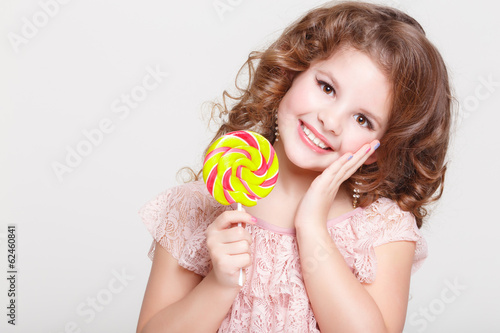 funny baby eating candyphoto