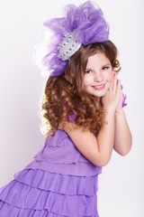 Fashion little girl in fashion violet dress, trendy kid
