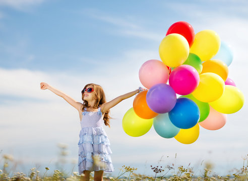 happy girl with colorful balloons