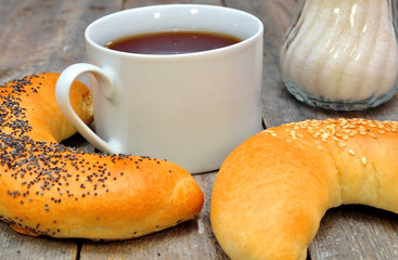 bagel with poppy seeds and a cup of tea