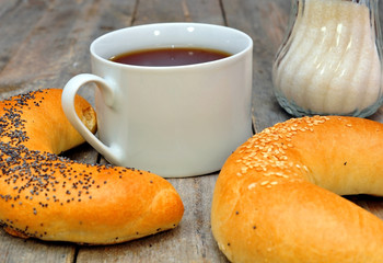 bagel with poppy seeds and a cup of tea