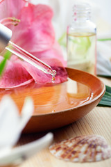 Essential oil for spa treatment in a dropper, spa setting