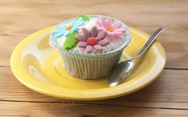 beautiful cupcakes on vintage wooden background