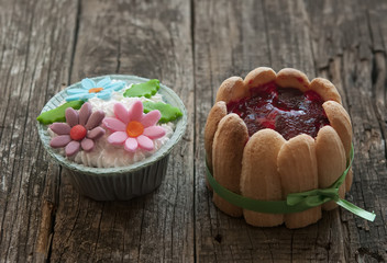 beautiful cupcakes on vintage wooden background