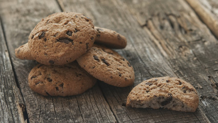 Oatmeal cookies with raisins on vintage wooden background