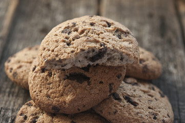 Oatmeal cookies with raisins on vintage wooden background