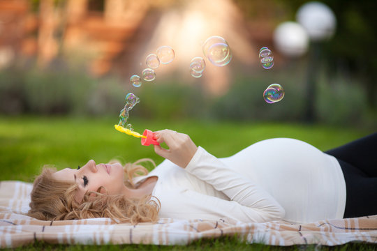 Happy pregnant woman in spring outdoor