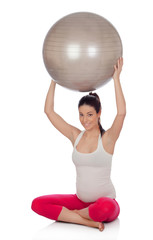 Beautiful pregnant woman doing pilates