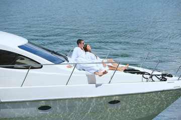 young couple on yacht