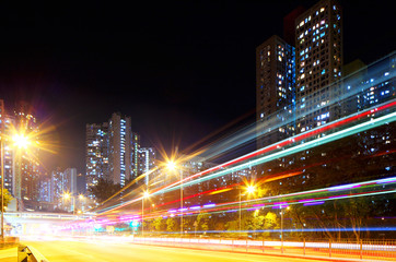 Fototapeta na wymiar Fast moving car light in city