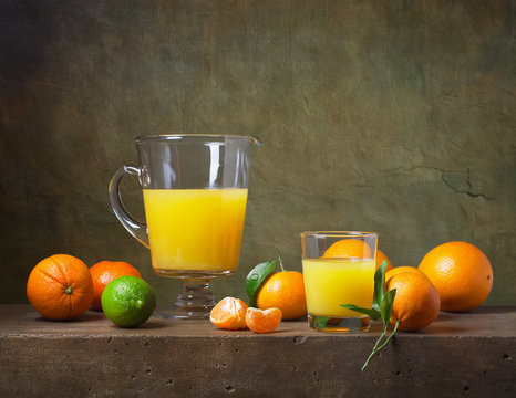 Still life with citrus fruit and orange juice