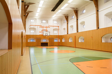 Fototapeta premium Empty interior of public gym with basketball court