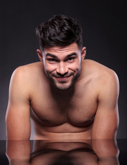 Fototapeta premium naked young man smiles at you