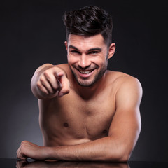 Fototapeta premium naked young man points at you