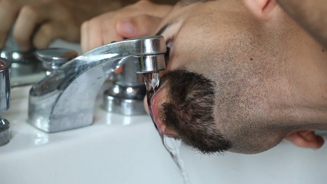 Young Man Drinking Water