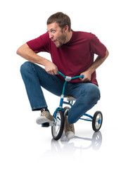 Curious man on a children's bicycle on white background