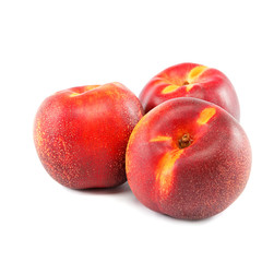 Fresh nectarines on a white background.