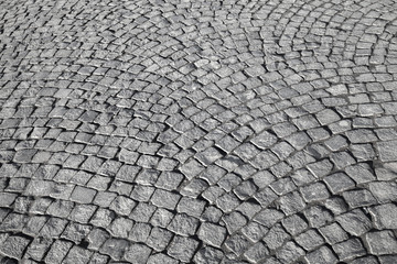 Gray granite stone pavement. Detailed background texture