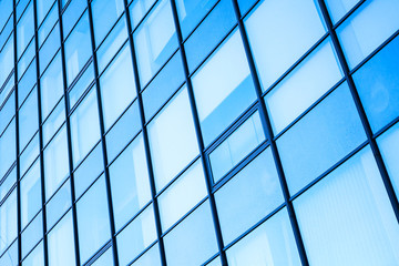 Moder office facade with blue shining glass ans steel frames