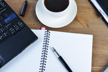 notebook and cup of coffee