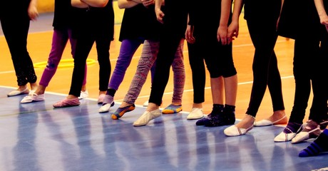 young girls in tracksuit ready to file for the rhythmic gymnasti