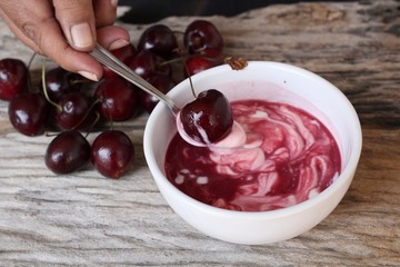 Yogurt and fresh cherries.