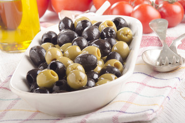 green and black olive in a bowl