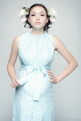 Portrait of pregnant woman in blue dress.